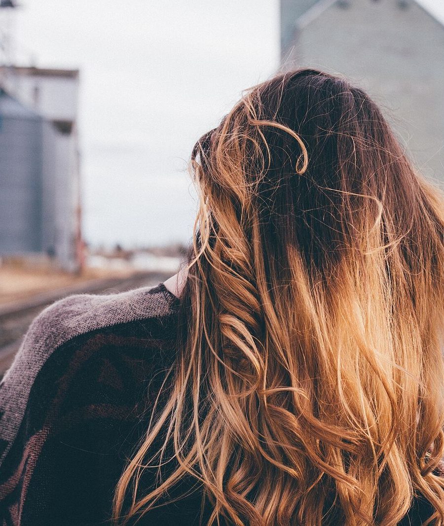 Long hair with a honey balayage, seen from behind